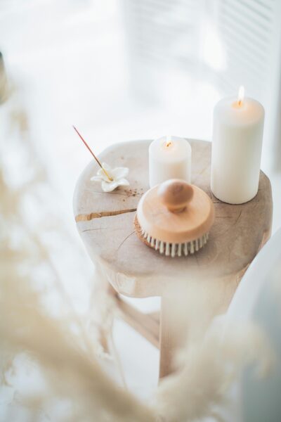 A flickering candle casting a warm and relaxing ambiance on board a luxury crewed yacht - Horizon Luxury Crewed