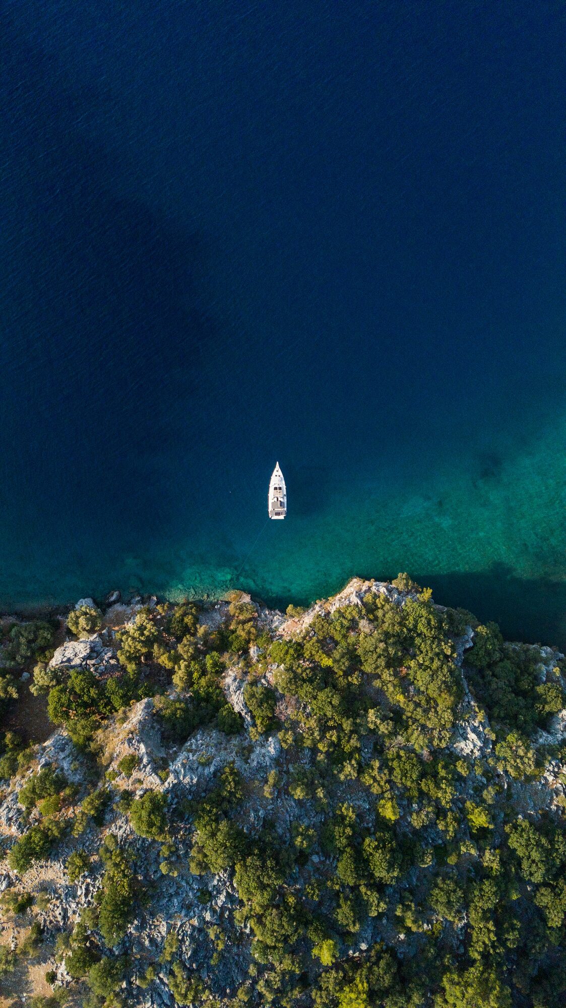 A lone luxury yacht sailing the stunning turquoise waters of Turkey - Horizon Luxury Crewed