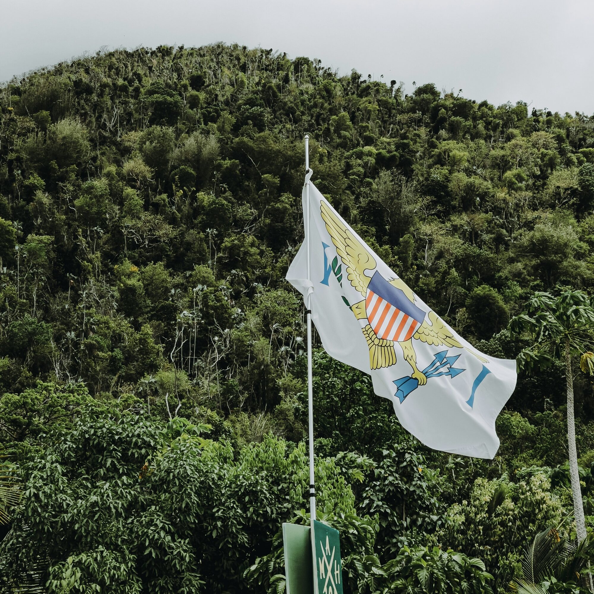 The US Virgin Islands flag waving proudly in the ocean breeze - Horizon Luxury Crewed